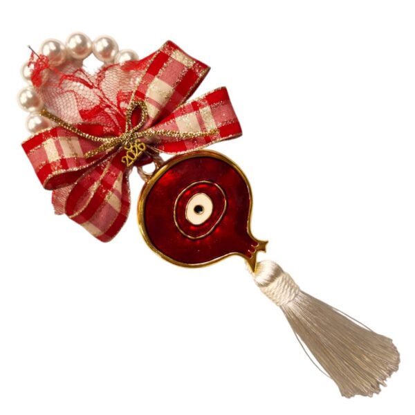 Γούρι 2026 με κόκκινο σμάλτο ρόδι, ματάκι και φούντα – χειροποίητο και εορταστικό.