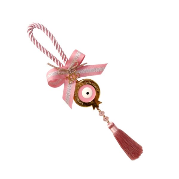 Γούρι 2026 με ροζ κορδόνι, μεταλλικό ρόδι με σμάλτο, ματάκι και φούντα – ρομαντικό και πολυτελές.