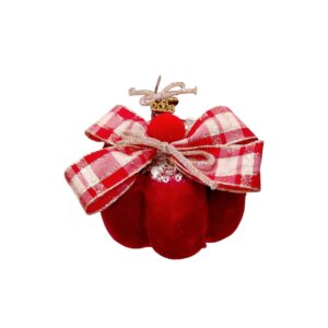 Κόκκινη βελούδινη κολοκύθα 2026 με glitter φιόγκο και εορταστικές λεπτομέρειες.