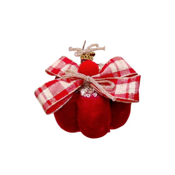 Κόκκινη βελούδινη κολοκύθα 2026 με glitter φιόγκο και εορταστικές λεπτομέρειες.