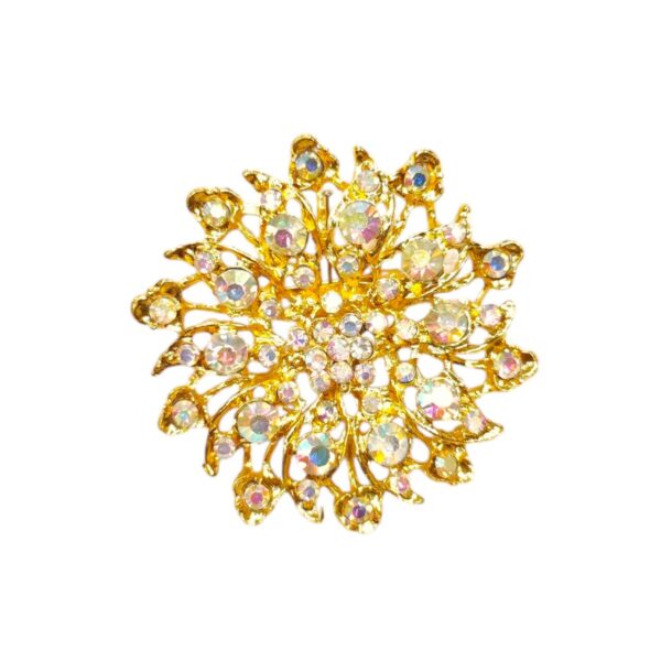 Καρφίτσα-άνθος με ιριδίζοντα στρας – λαμπερή πολυτέλεια με γιορτινή φινέτσα.