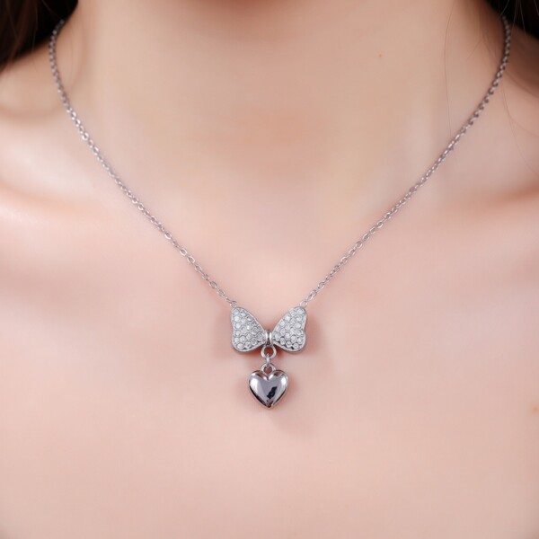 Ασημί ατσάλινο κολιέ καρδιά με κρυστάλλινο φιόγκο Avenue Fashion