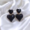 Ατσάλινα Σκουλαρίκια Αθήνα Καλλιθέα Avenue Fashion τρισδιάστατες μαύρες καρδιές.
